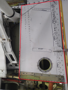 damaged lower portion of the left wing , included in the red lines– rivets damaged have been circled by a marking pen in black ink